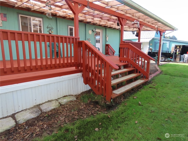 wooden terrace featuring a pergola and a lawn