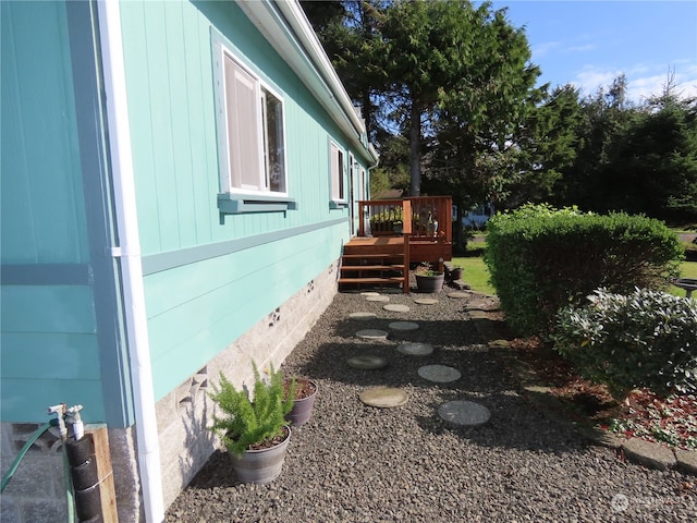 view of side of home featuring a deck