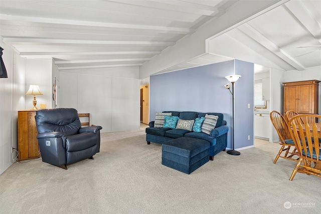 living room featuring light carpet and lofted ceiling with beams