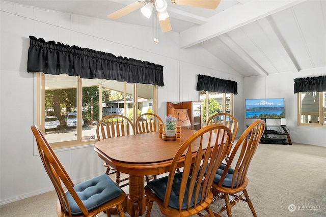carpeted dining space with ceiling fan