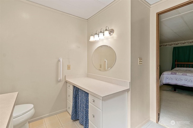 bathroom featuring vanity, toilet, connected bathroom, crown molding, and baseboards