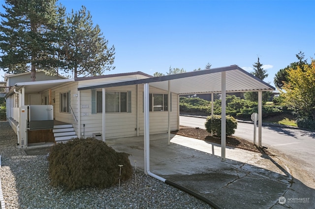 view of front of property with a carport