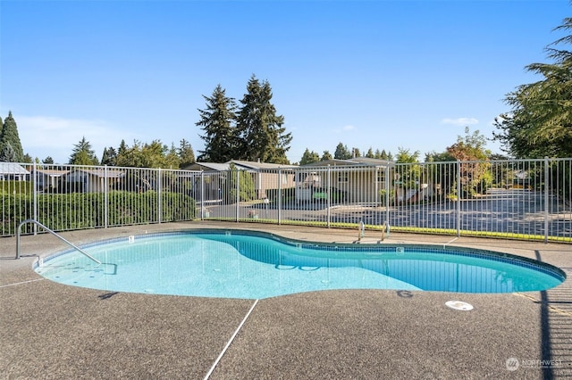 view of pool with fence
