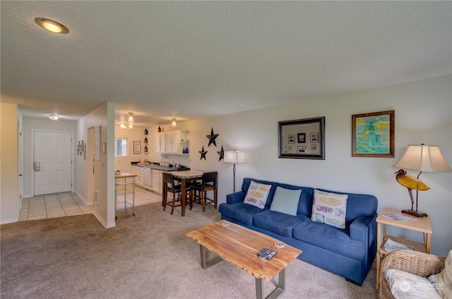 living room with light carpet and a textured ceiling