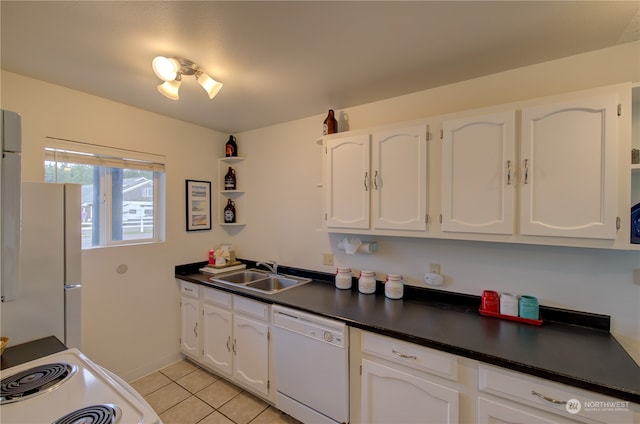 kitchen with white cabinets, sink, and white appliances