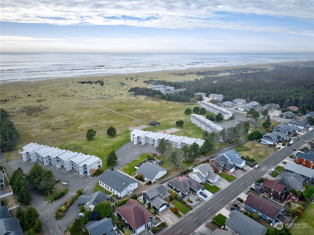 aerial view featuring a water view and a view of the beach