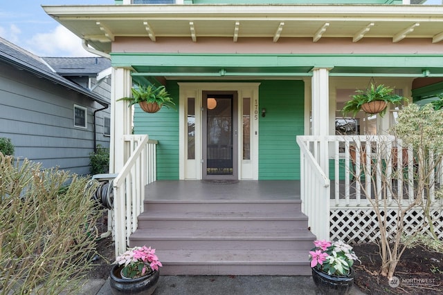 doorway to property featuring a porch