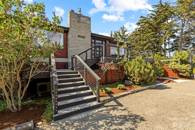 rear view of house featuring a deck