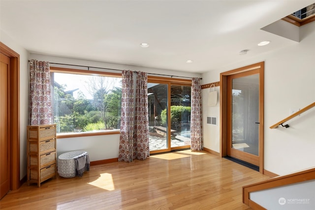 doorway with light hardwood / wood-style floors