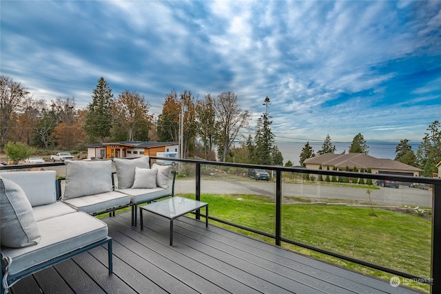 wooden deck with a lawn