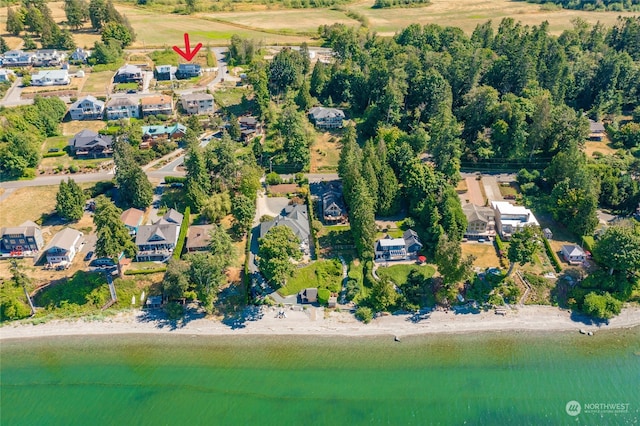 aerial view with a water view and a beach view