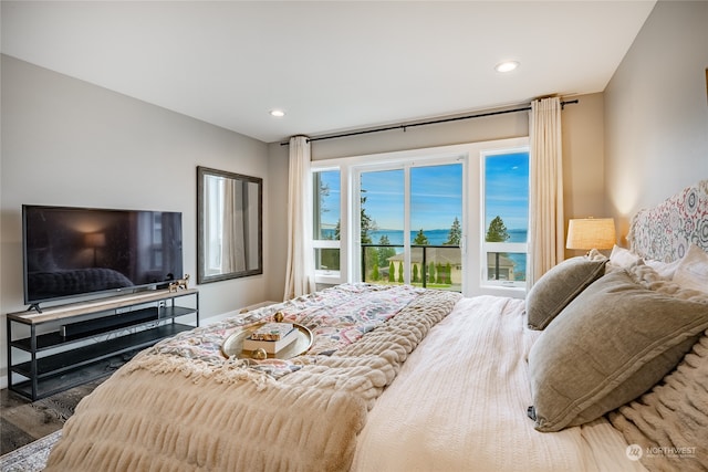 bedroom featuring access to outside and dark hardwood / wood-style floors