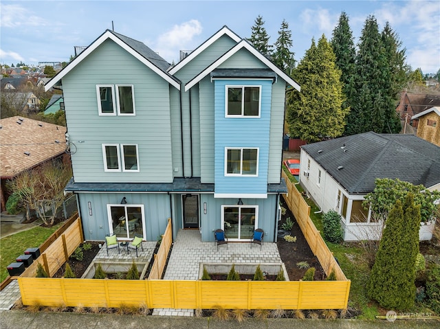 rear view of property with a patio area