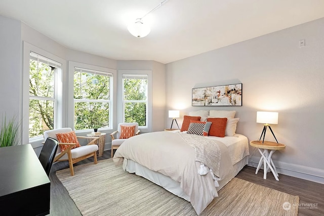 bedroom with wood-type flooring