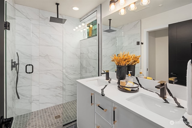 bathroom featuring vanity and a shower with shower door