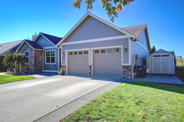 view of front of home with a front yard and a garage