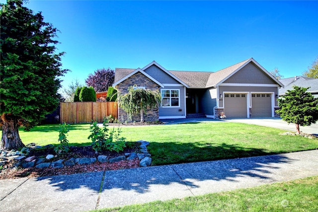 view of front of property with a front yard and a garage