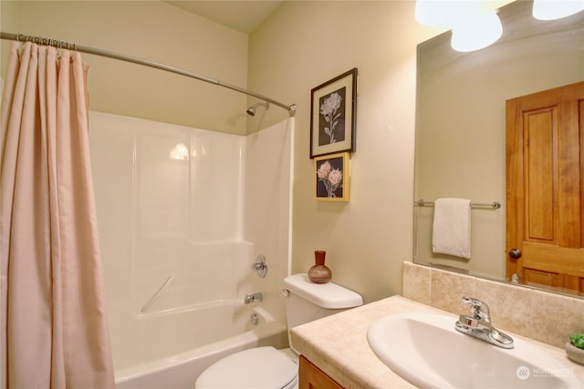 full bathroom featuring toilet, shower / bath combination with curtain, and vanity