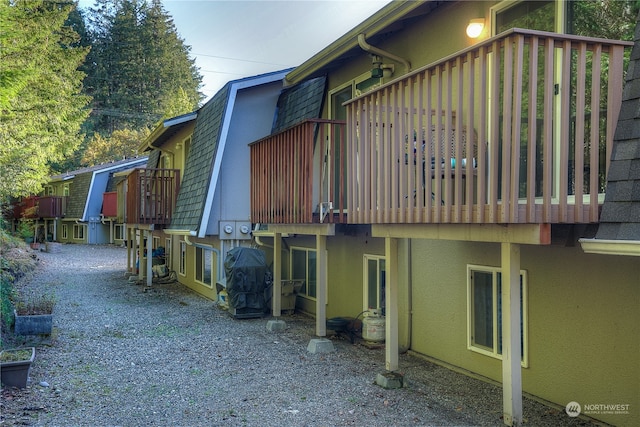 view of side of home featuring a balcony