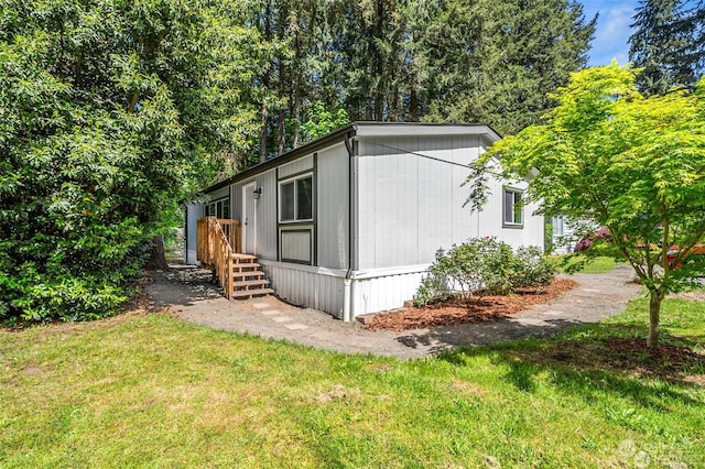 view of home's exterior featuring a lawn