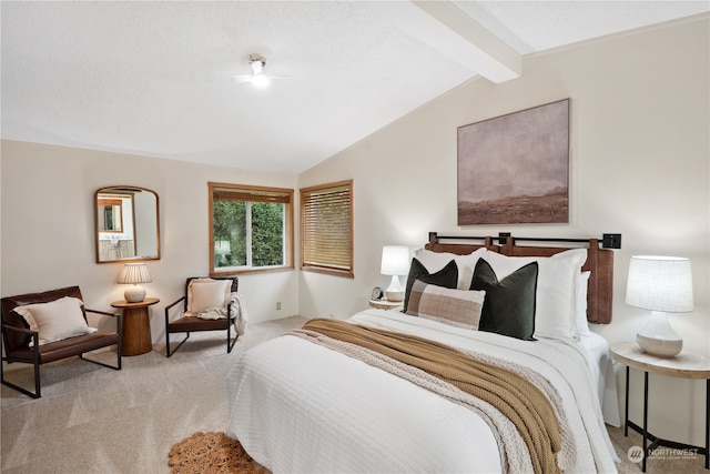 bedroom featuring lofted ceiling with beams and light colored carpet