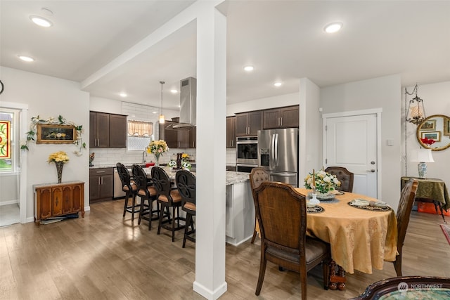 dining space featuring hardwood / wood-style floors