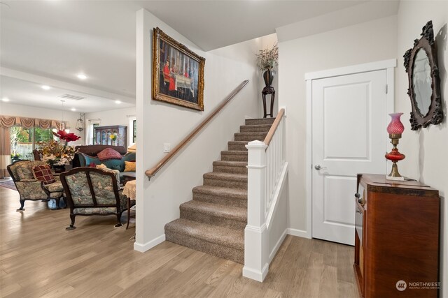 staircase featuring wood-type flooring