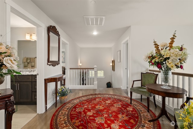 hall with light wood-type flooring