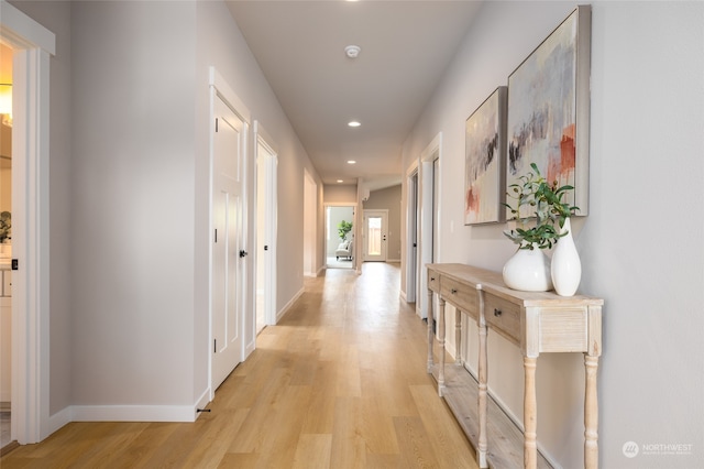 corridor with light wood-type flooring