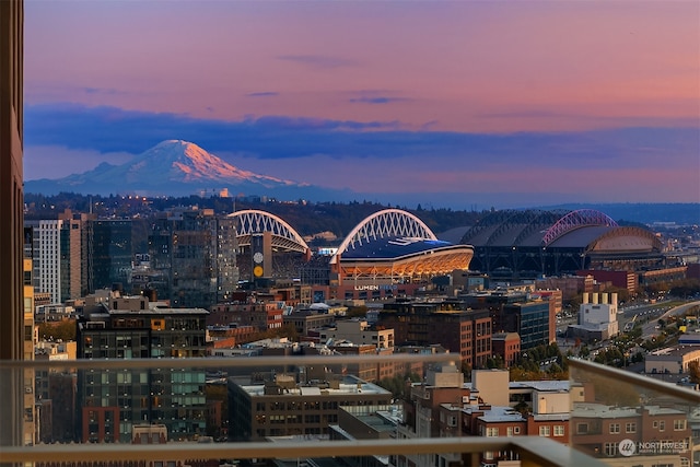 property's view of city with a mountain view