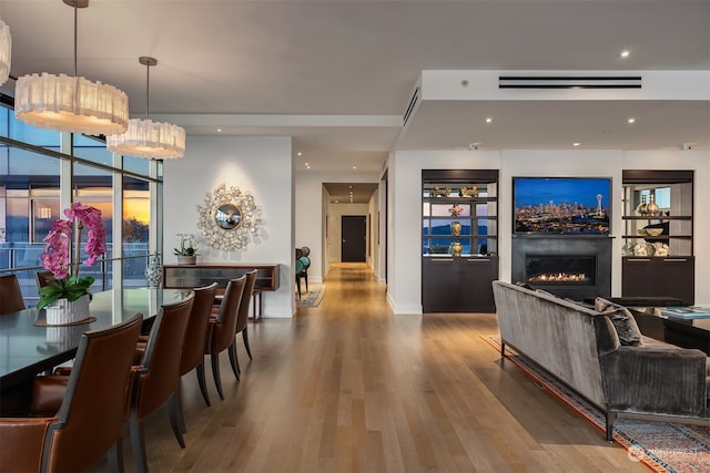 dining room featuring hardwood / wood-style flooring and a wealth of natural light