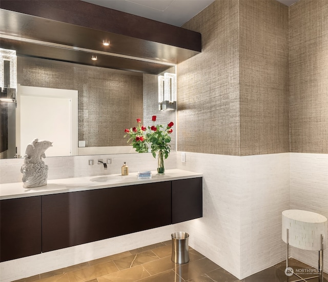 bathroom featuring vanity, tile walls, and tile patterned flooring