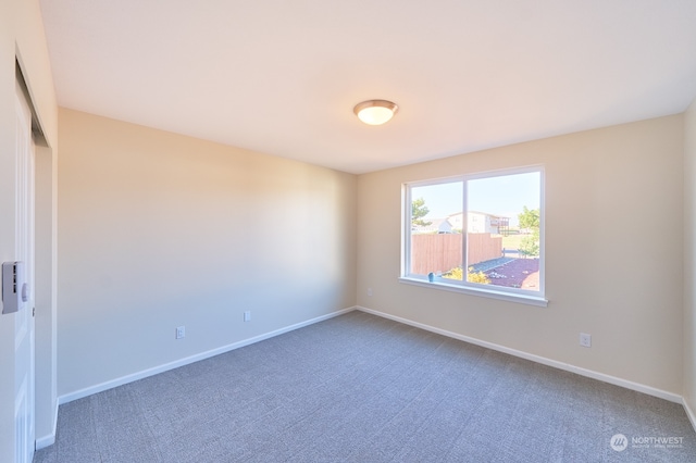 empty room featuring carpet flooring