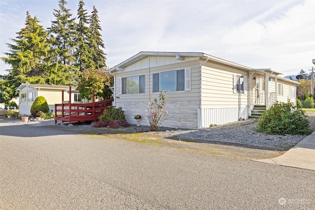 view of front of house featuring a wooden deck