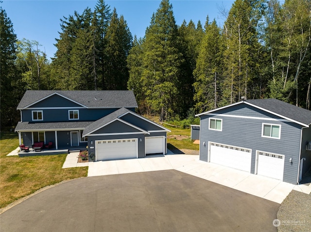 front facade with a garage and a front yard