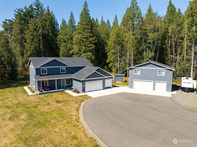 front of property with a front yard and a garage