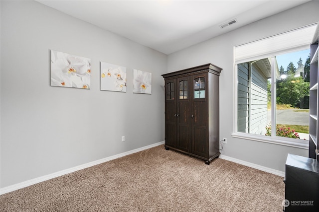 unfurnished bedroom featuring light colored carpet