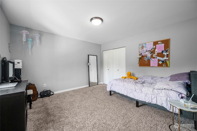 bedroom featuring a closet and carpet