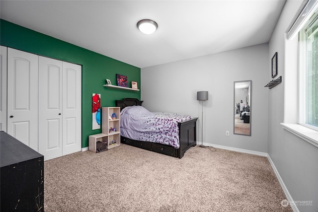 bedroom with a closet and carpet