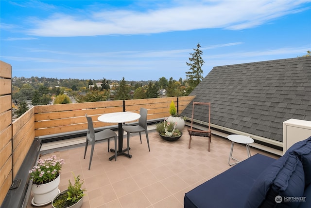 view of patio featuring a balcony