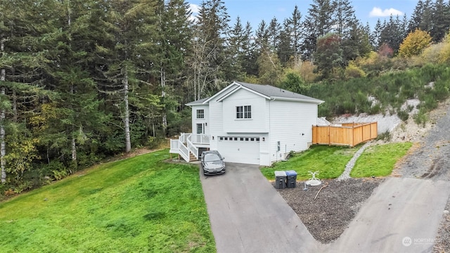 view of front of house featuring a front yard and a garage