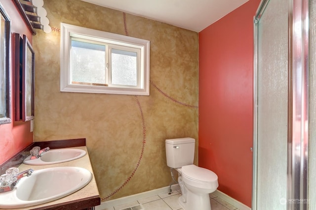 bathroom with vanity, toilet, an enclosed shower, and tile patterned floors