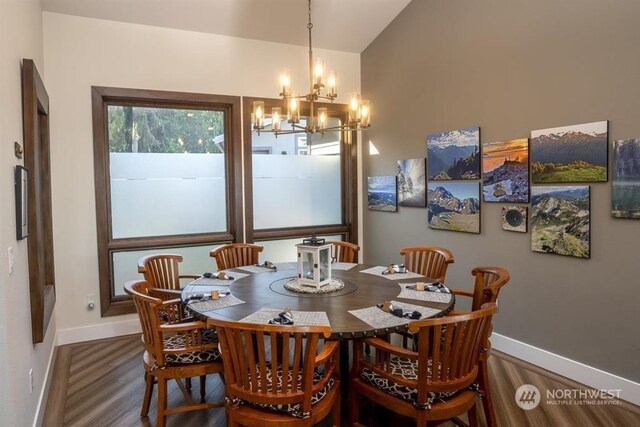 96 Forrest Rd, Sequim, WA 98382 - dining space featuring a chandelier, baseboards, wood finished floors, and vaulted ceiling