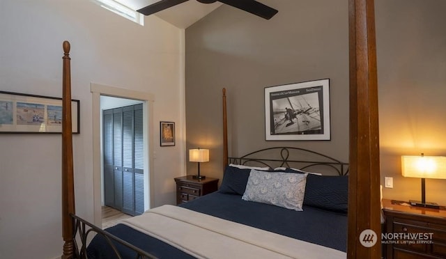 bedroom featuring lofted ceiling, a closet, and ceiling fan