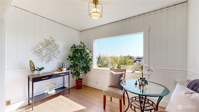 sitting room with wood-type flooring