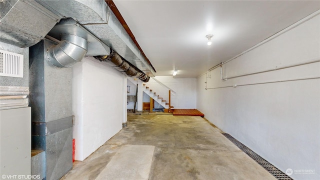 713 N Broadway St, Aberdeen, WA 98520 - basement with heating unit and stairs