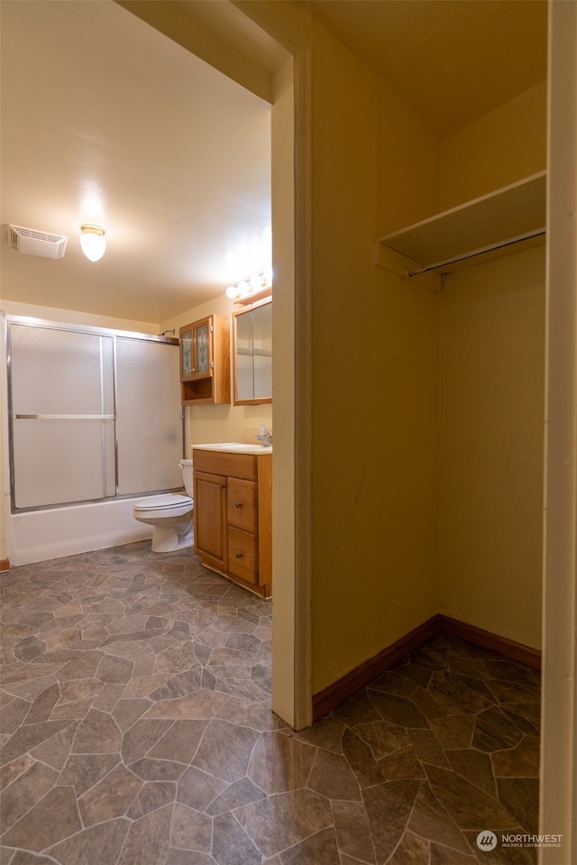 full bathroom with vanity, toilet, and washtub / shower combination