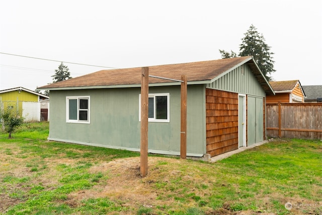 view of outbuilding featuring a yard