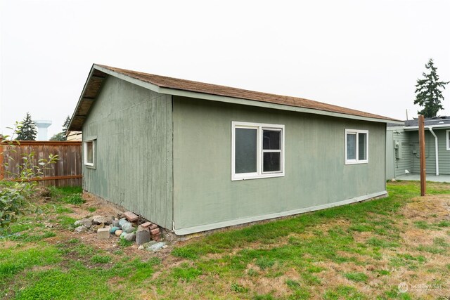 view of home's exterior with a yard