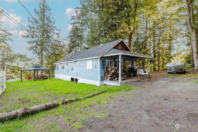10012 Brush Arbor Ln NW, Seabeck, WA 98380 - view of home's exterior featuring a yard, a gazebo, and roof with shingles